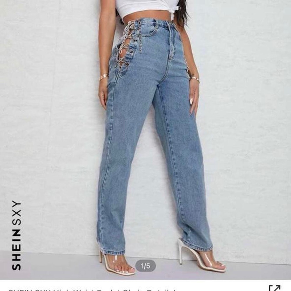 Light wash jeans with chain detail